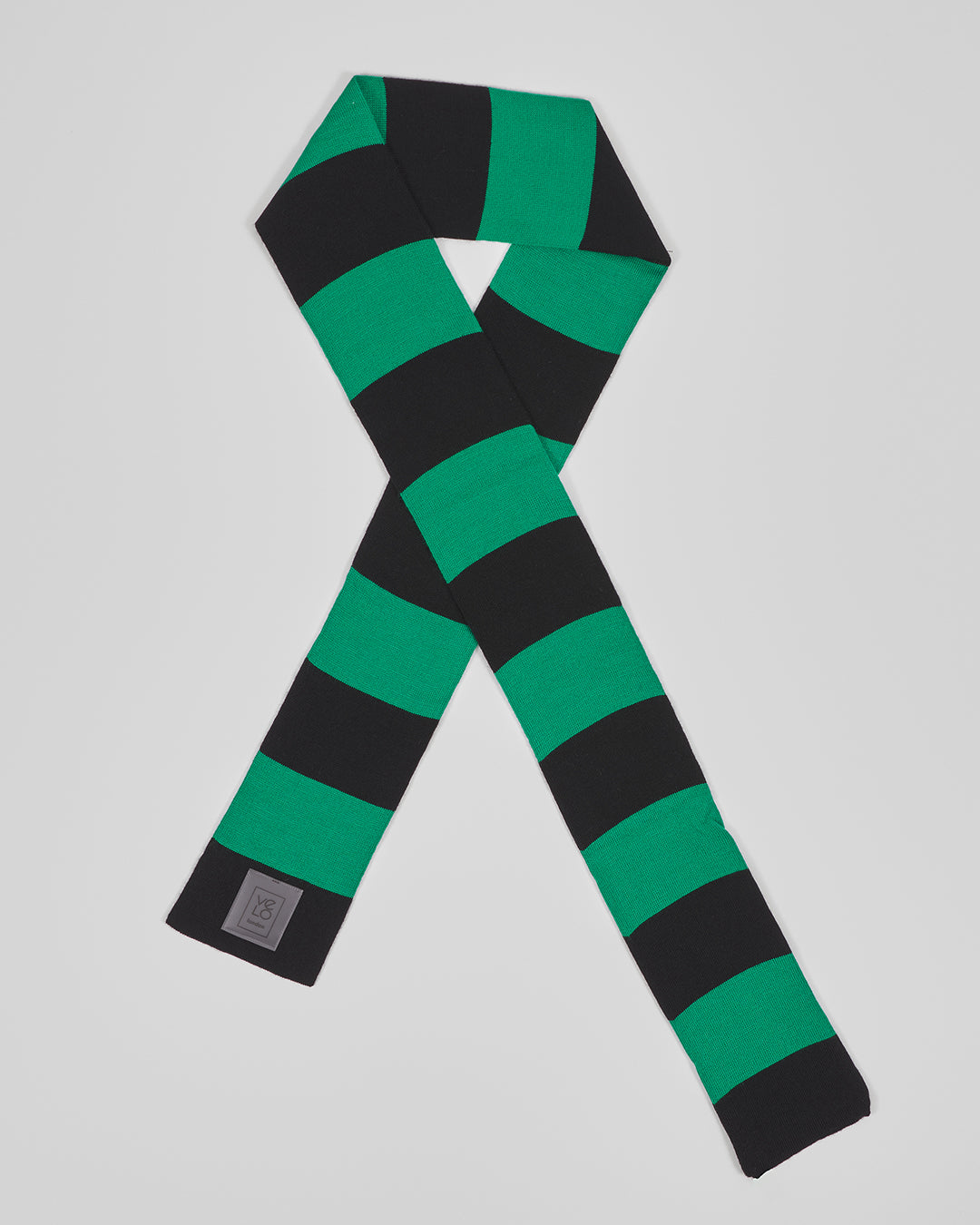 Black & Green unisex acrylic scarf flat lay in graphic black and vivid green