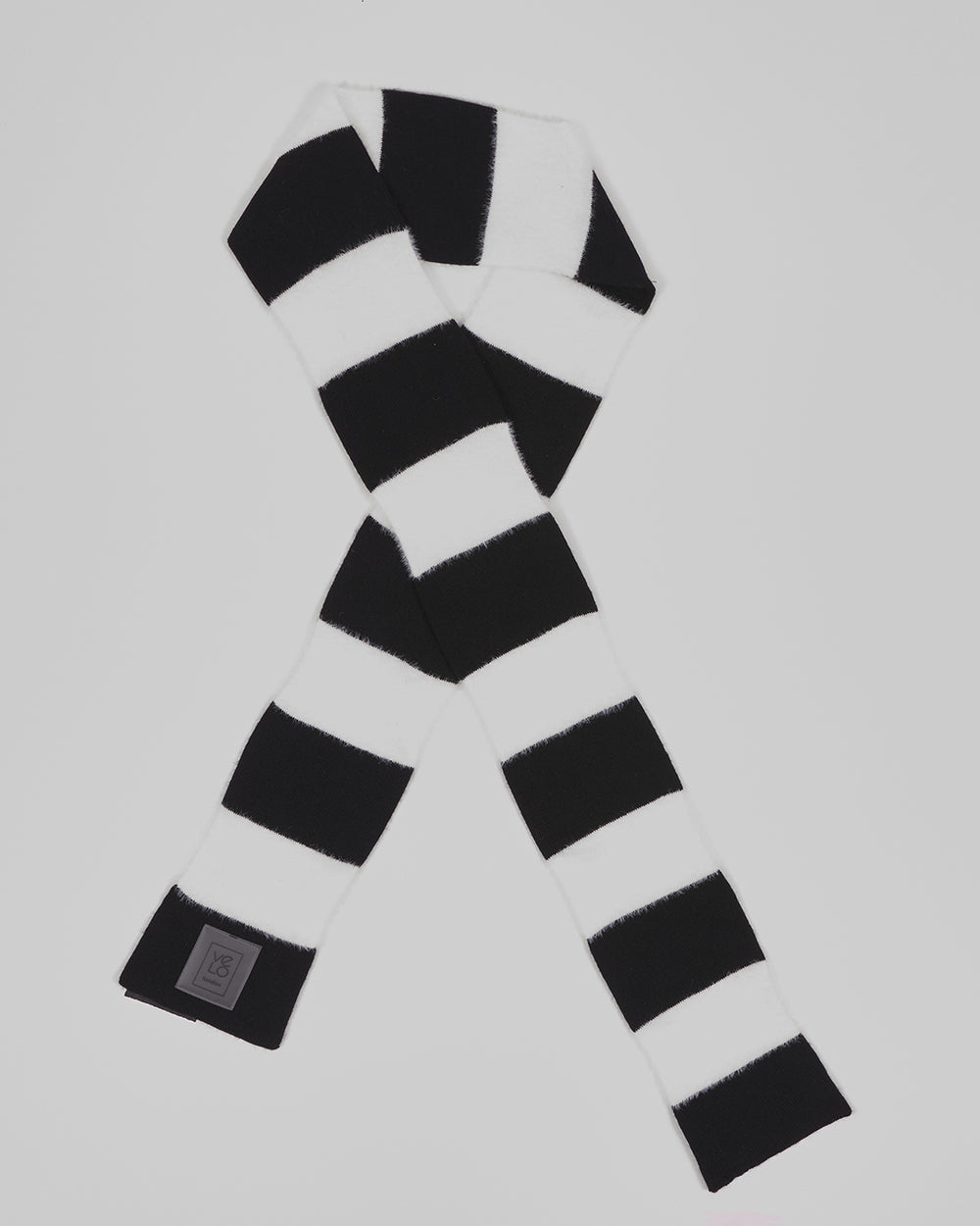 Black & White Lite unisex acrylic scarf flat lay in crisp black and white