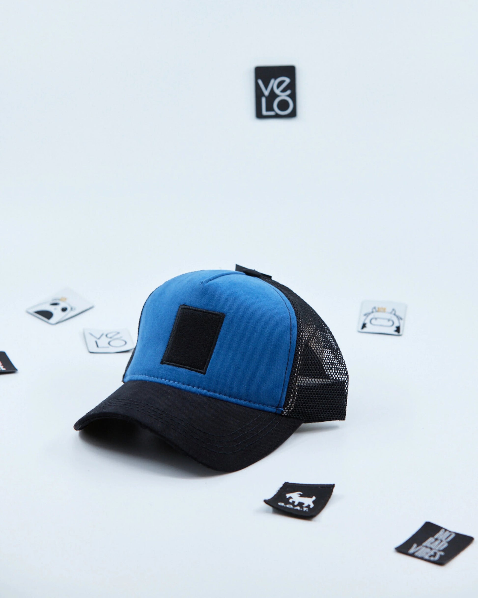 Side view of Blue and Black Customisable Trucker Cap
