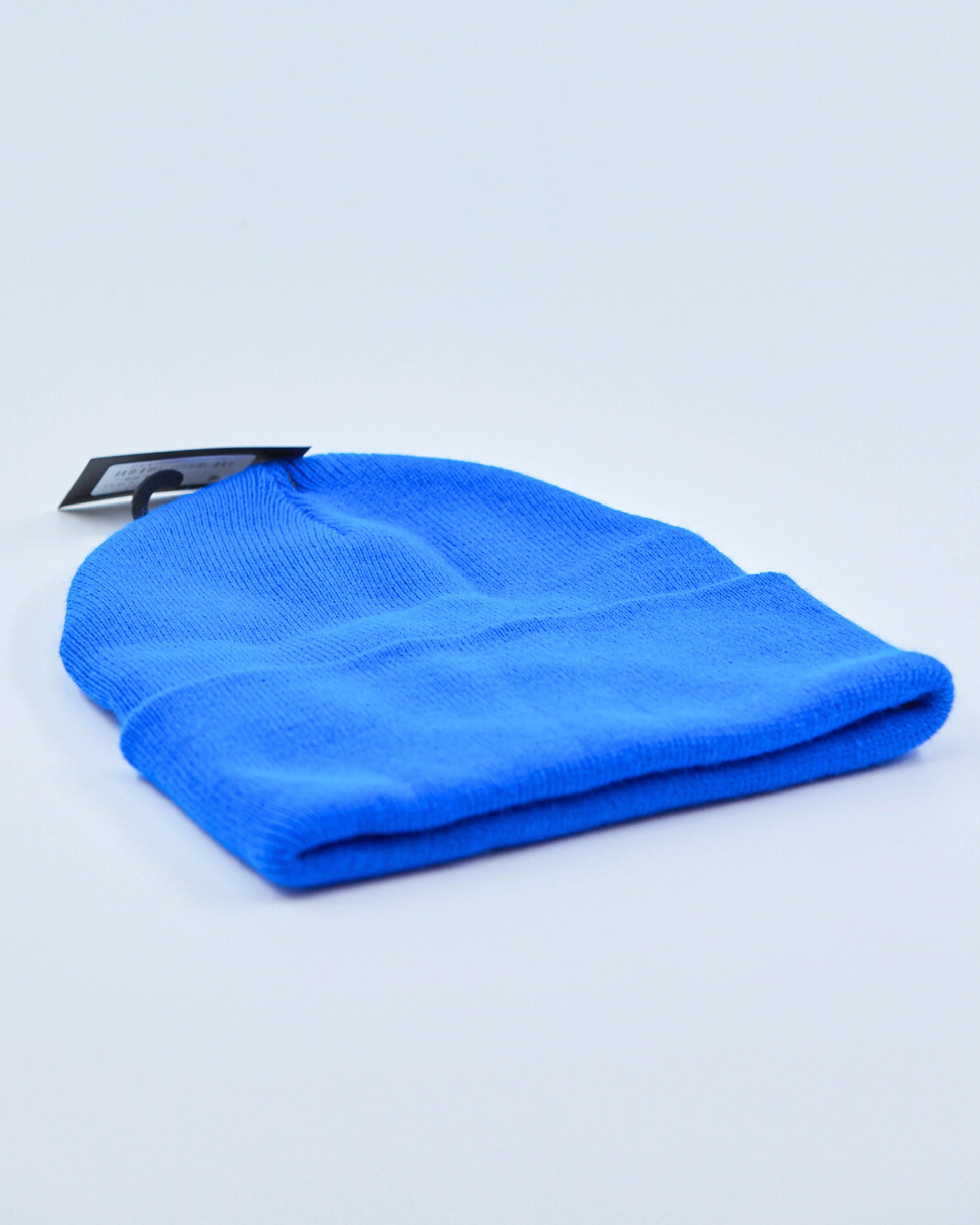 Blue beanie on a light gray background