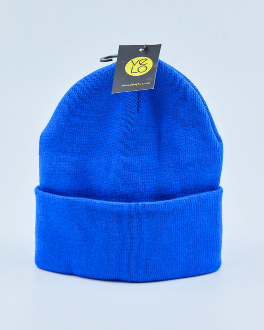 Blue beanie with a tag on a light gray background