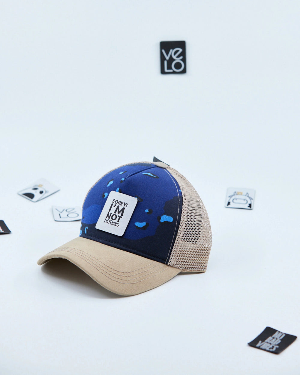 Side view of Blue Camo and Beige Customisable Trucker Cap with patches