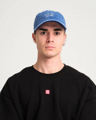 man wearing Cute But Psycho Blue Washed Cap Hat