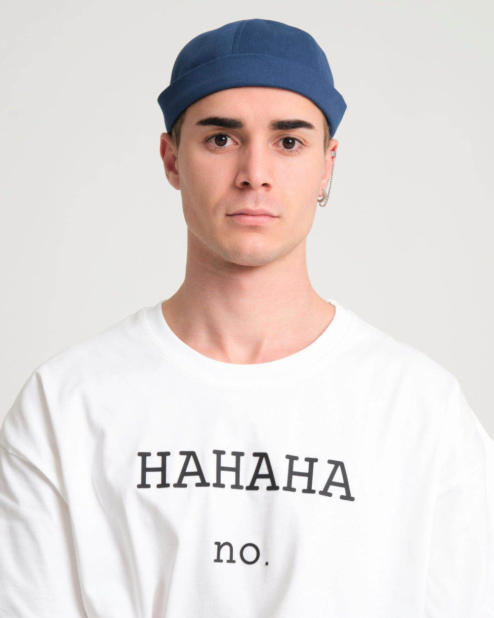 man wearing blue docker hat