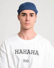man wearing blue docker hat