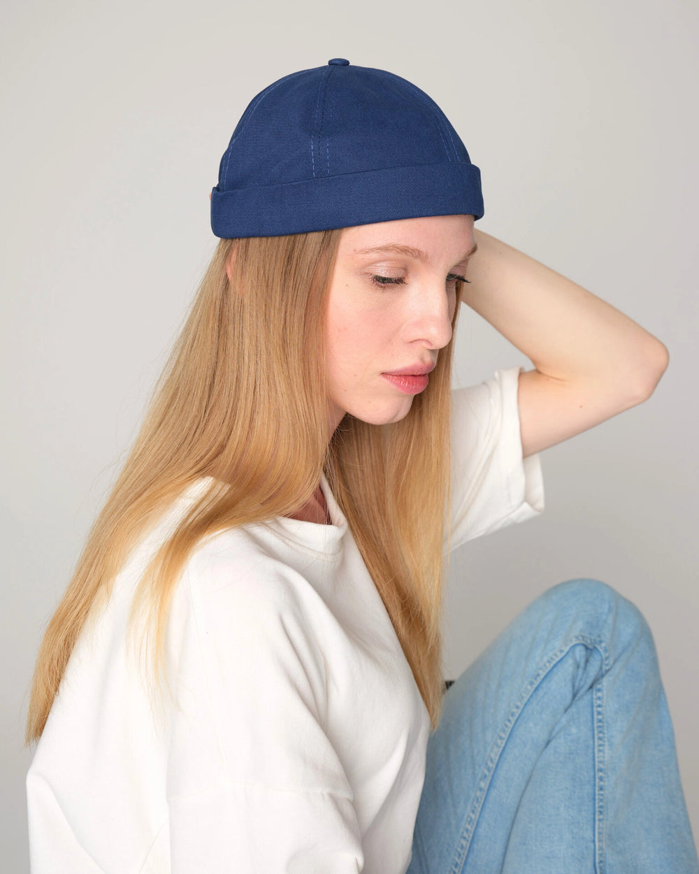 women wearing blue docker cap hat