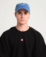 man wearing Hahaha No Blue Washed Cap