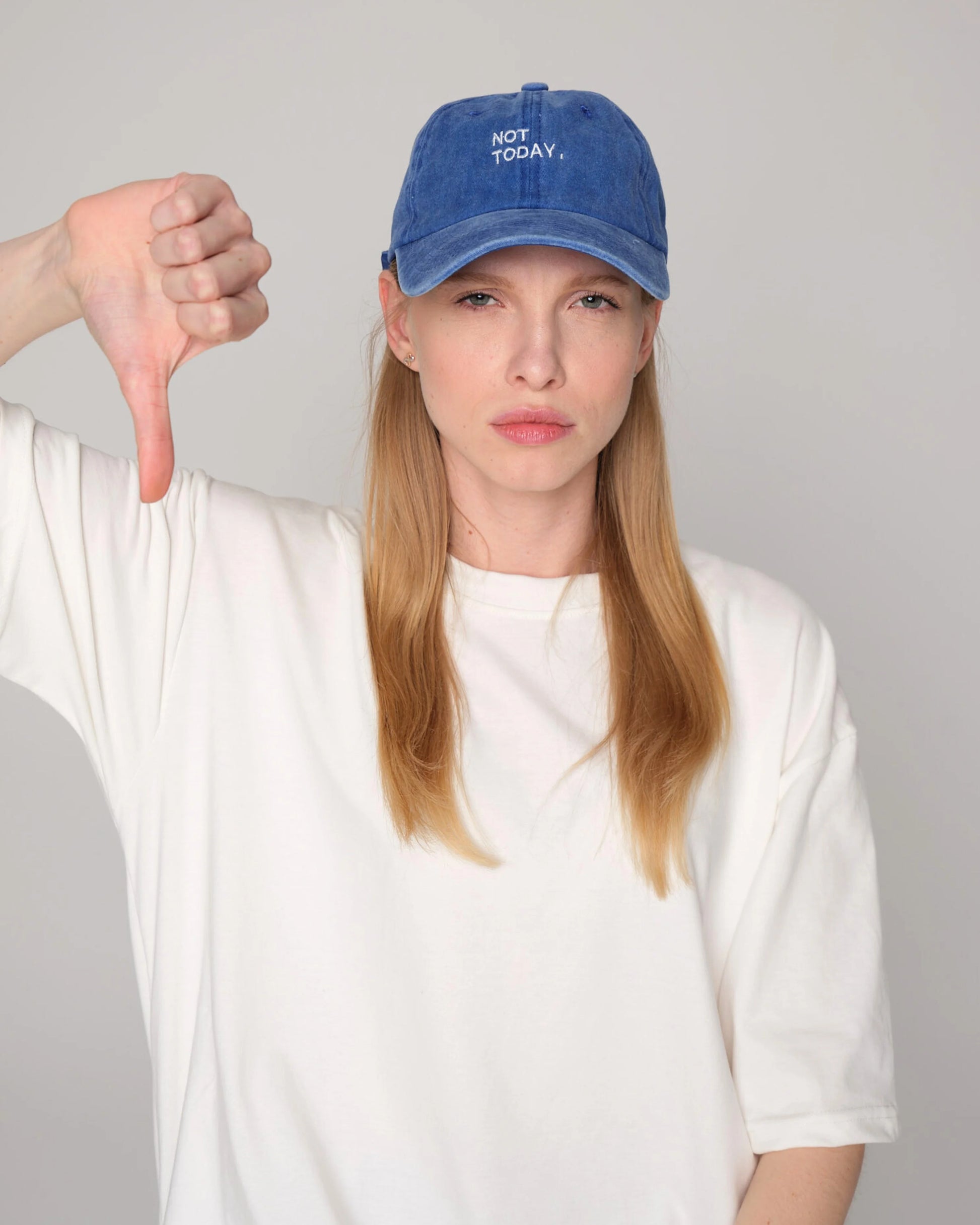 woman wearing Blue Washed Cap with Not Today embroidered in white