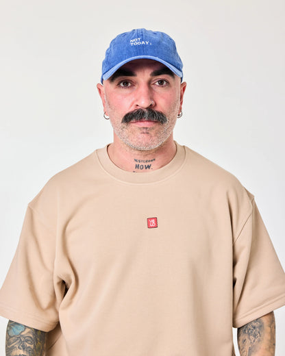 man wearing Blue Washed Cap with Not Today embroidered in white