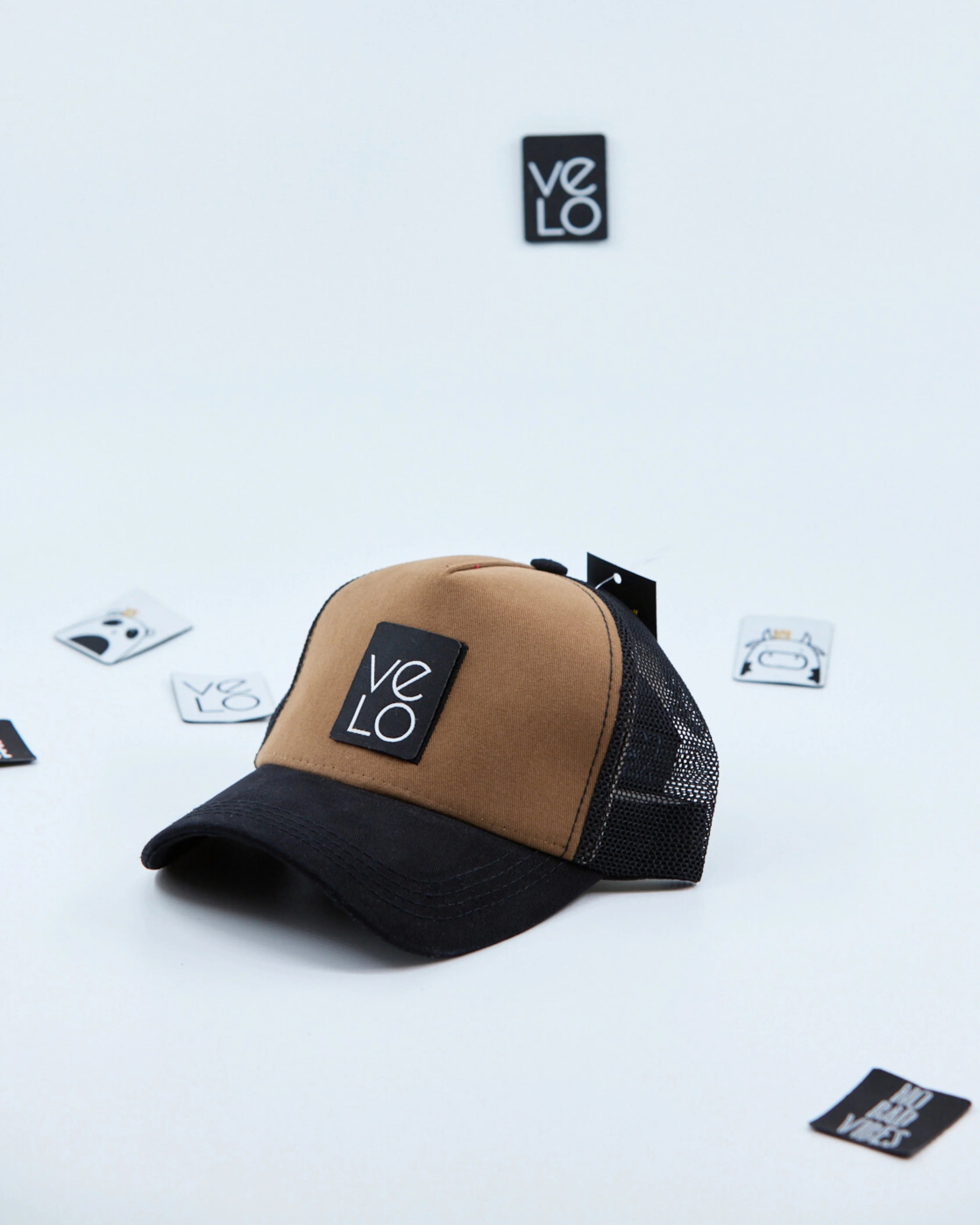 Side view of Brown and Black Customisable Trucker Cap with patches