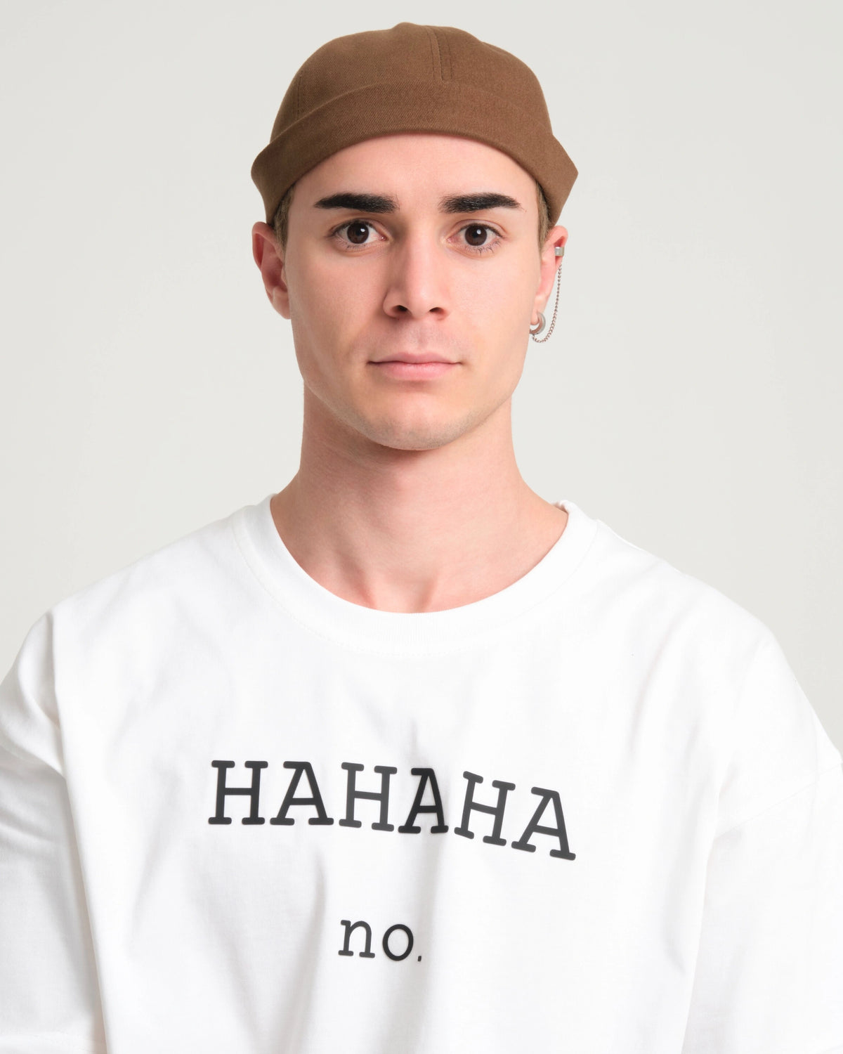 man wearing brown docker hat