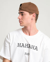 man wearing brown docker cap hat