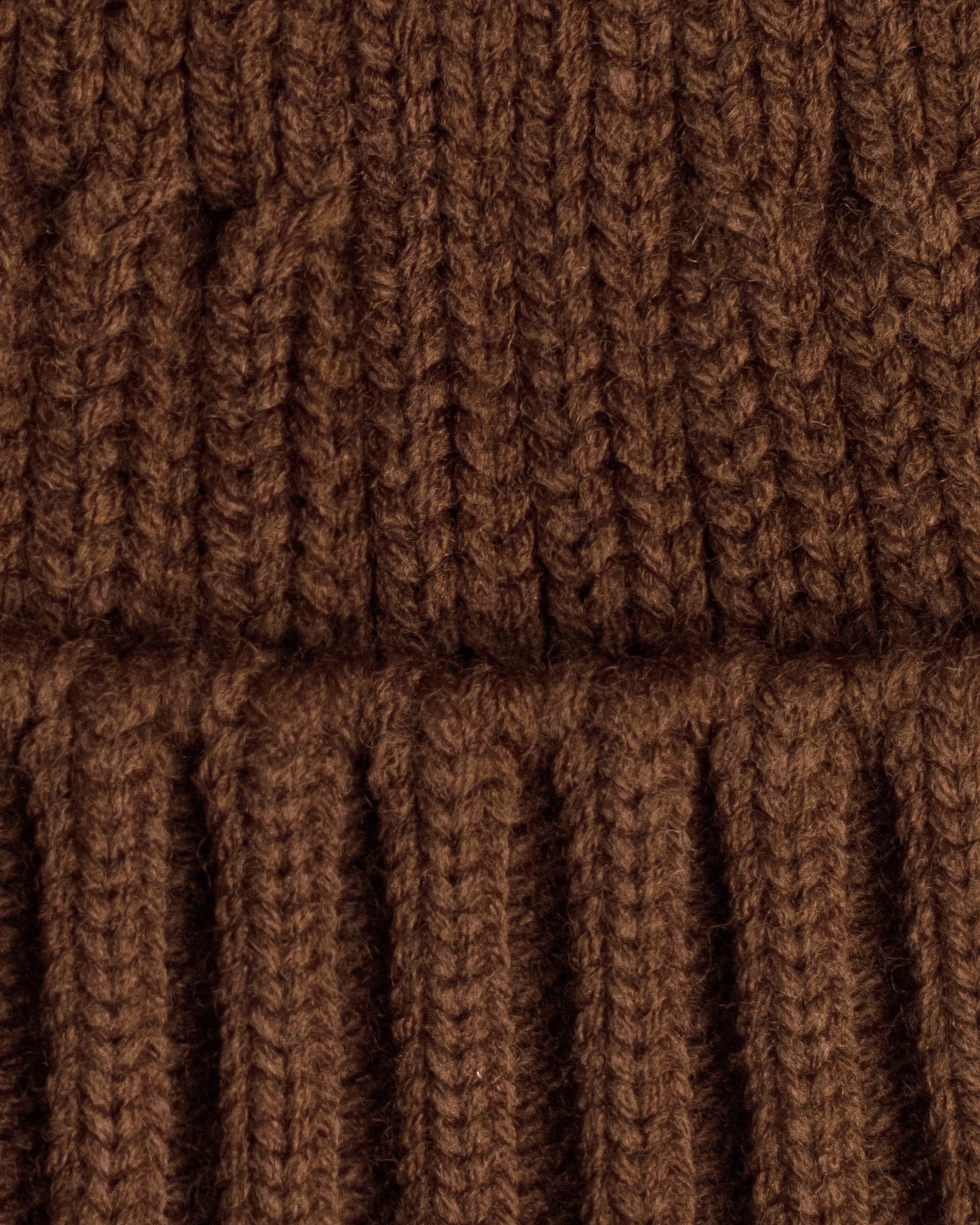 close detail of brown fisherman beanie