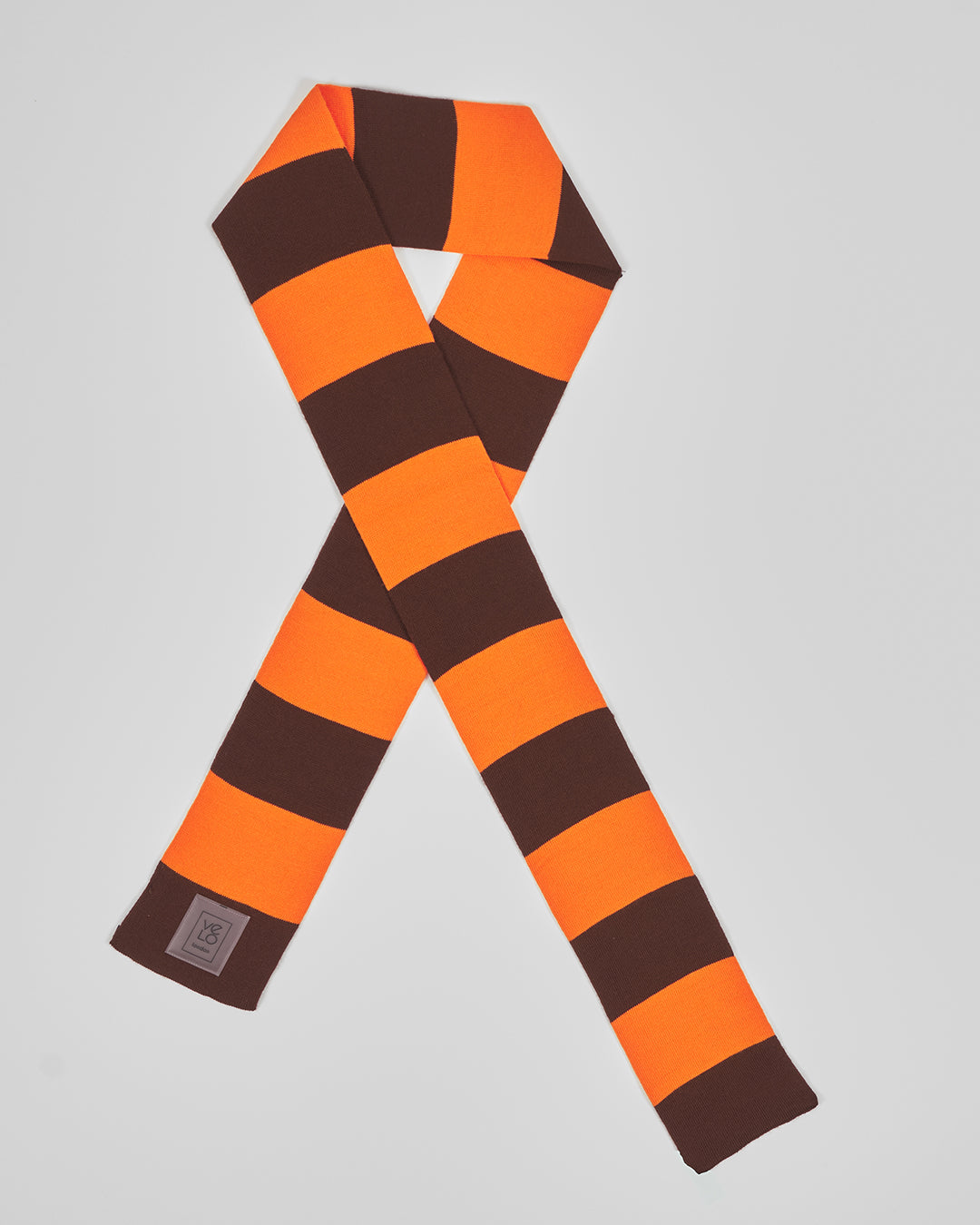 Brown & Orange unisex acrylic scarf flat lay in deep brown and vivid orange