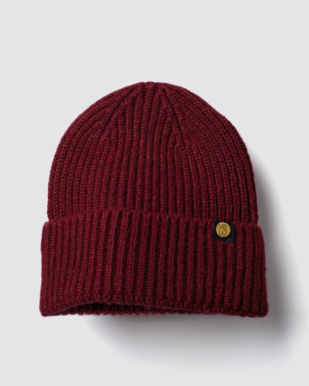 Burgundy Lux Beanie on a light gray background