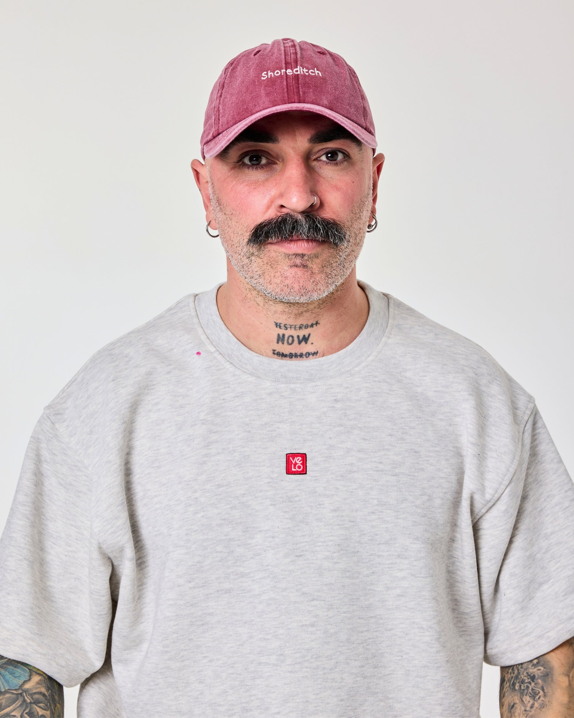 man wearing Shoreditch Burgundy Washed Cap Hat