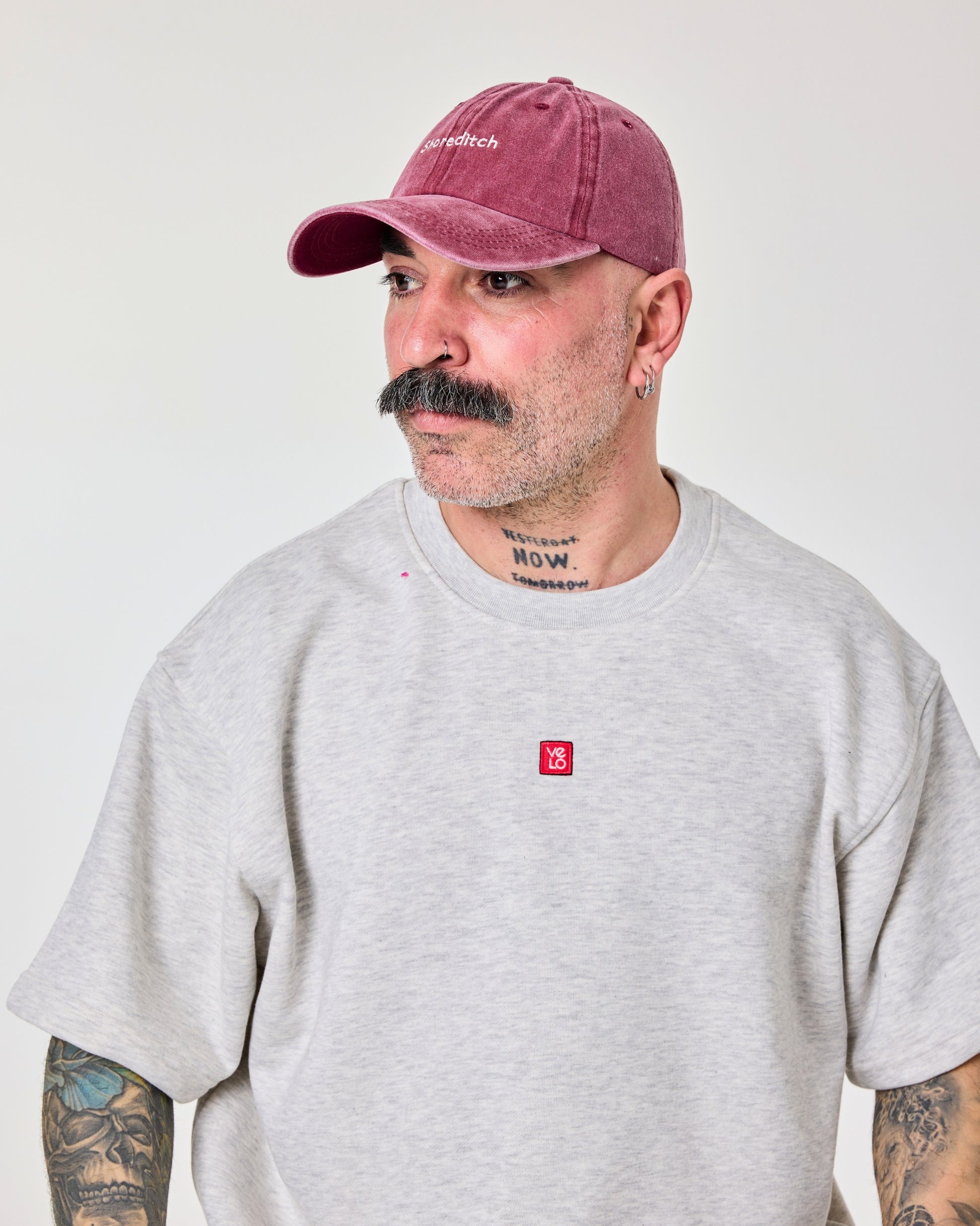 man wearing Shoreditch Burgundy Washed Cap