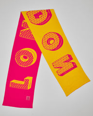 Carnaby Candy unisex acrylic scarf flat lay in candy pink and bright yellow