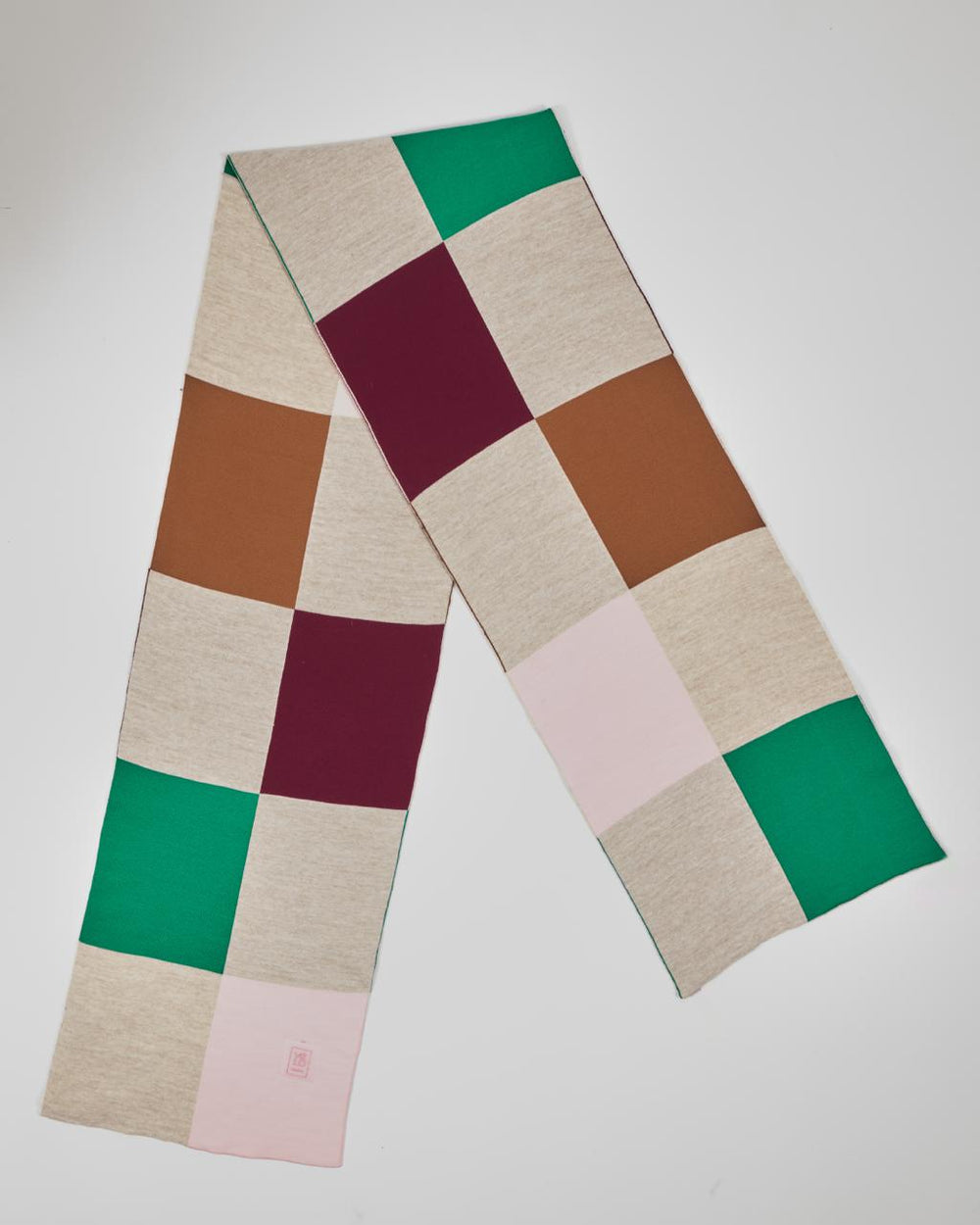 Chess unisex acrylic scarf flat lay in emerald green, burgundy, camel, blush and oatmeal cream