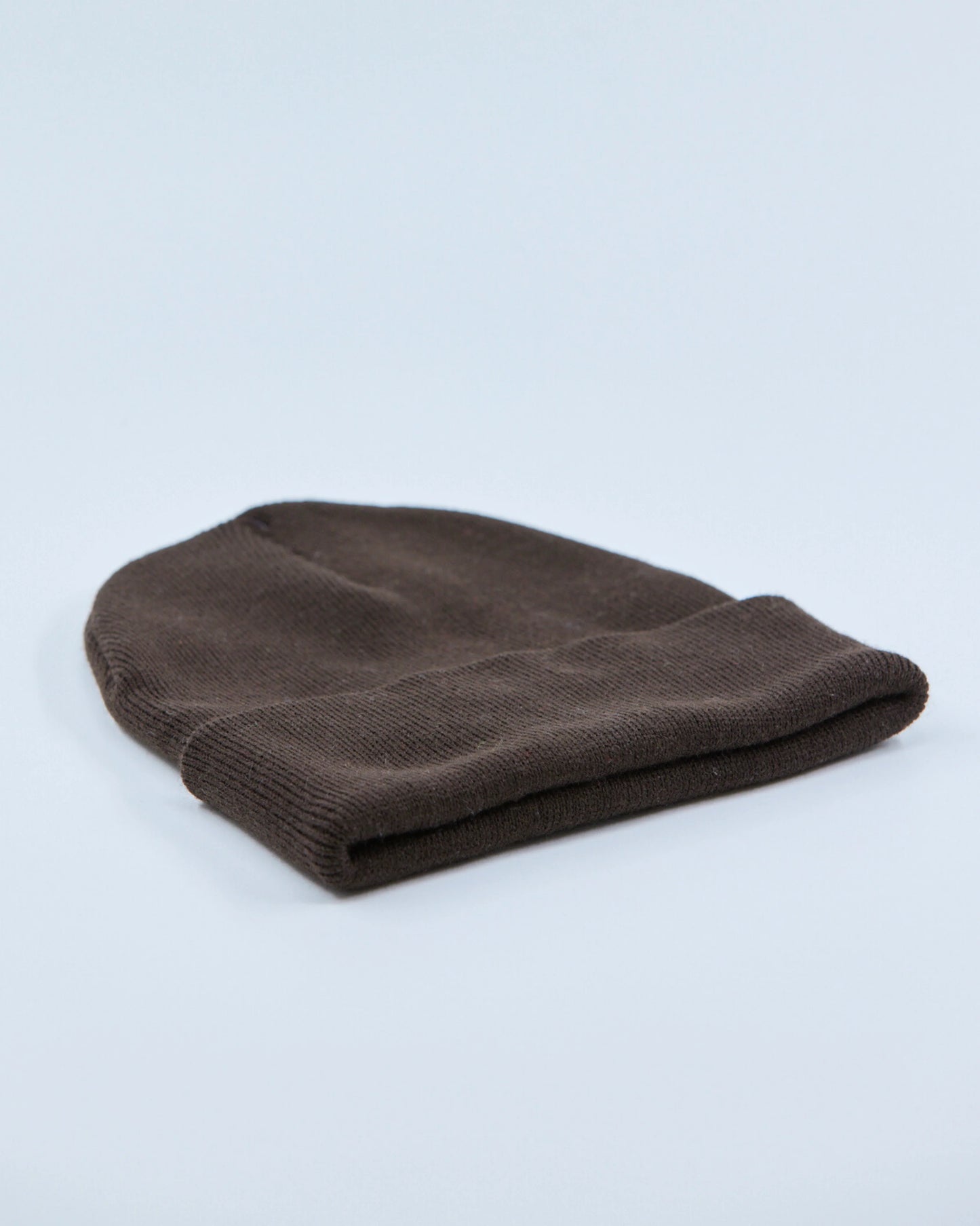 Chocolate beanie on a light gray background