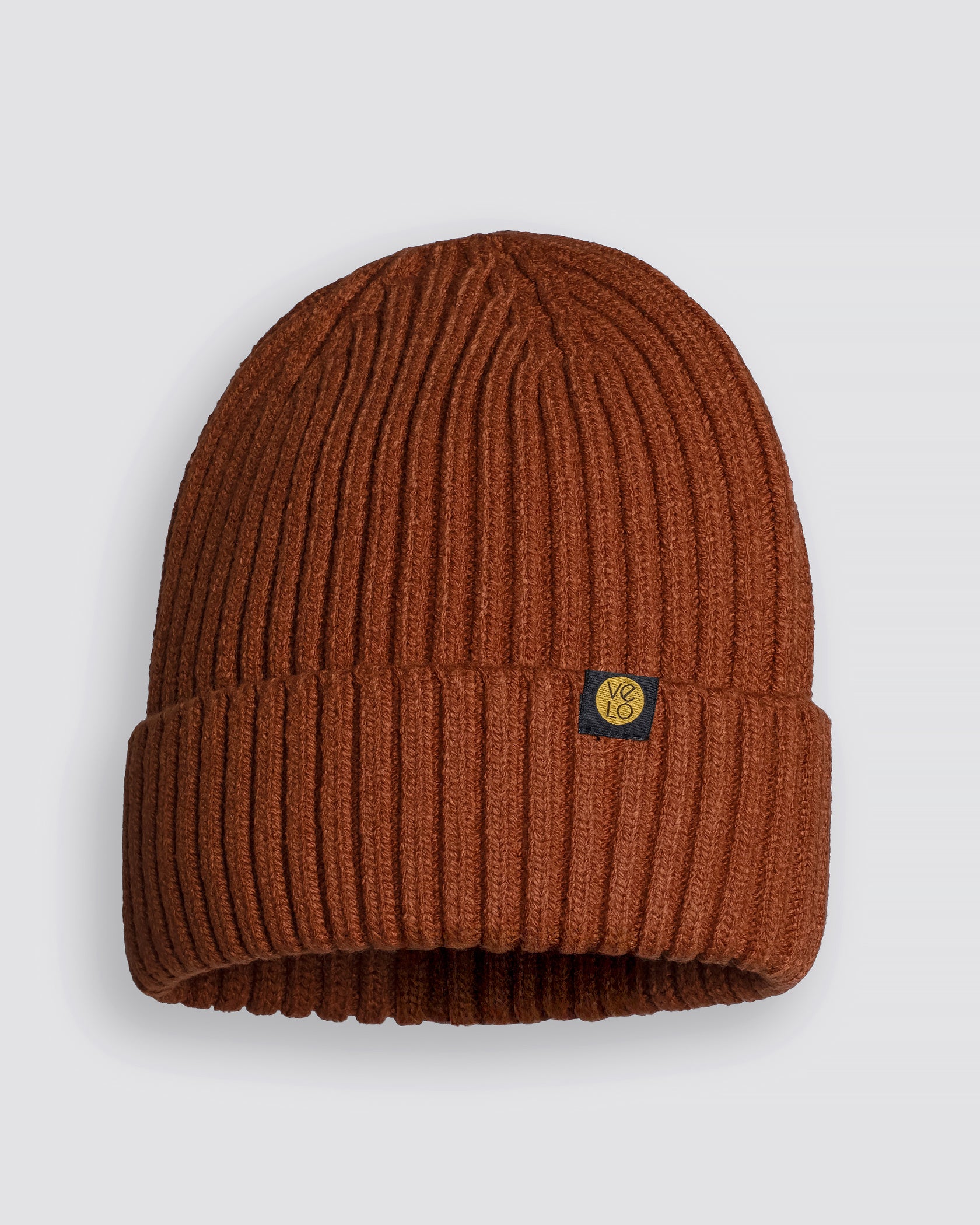 Cinnamon beanie with a logo on a light gray background