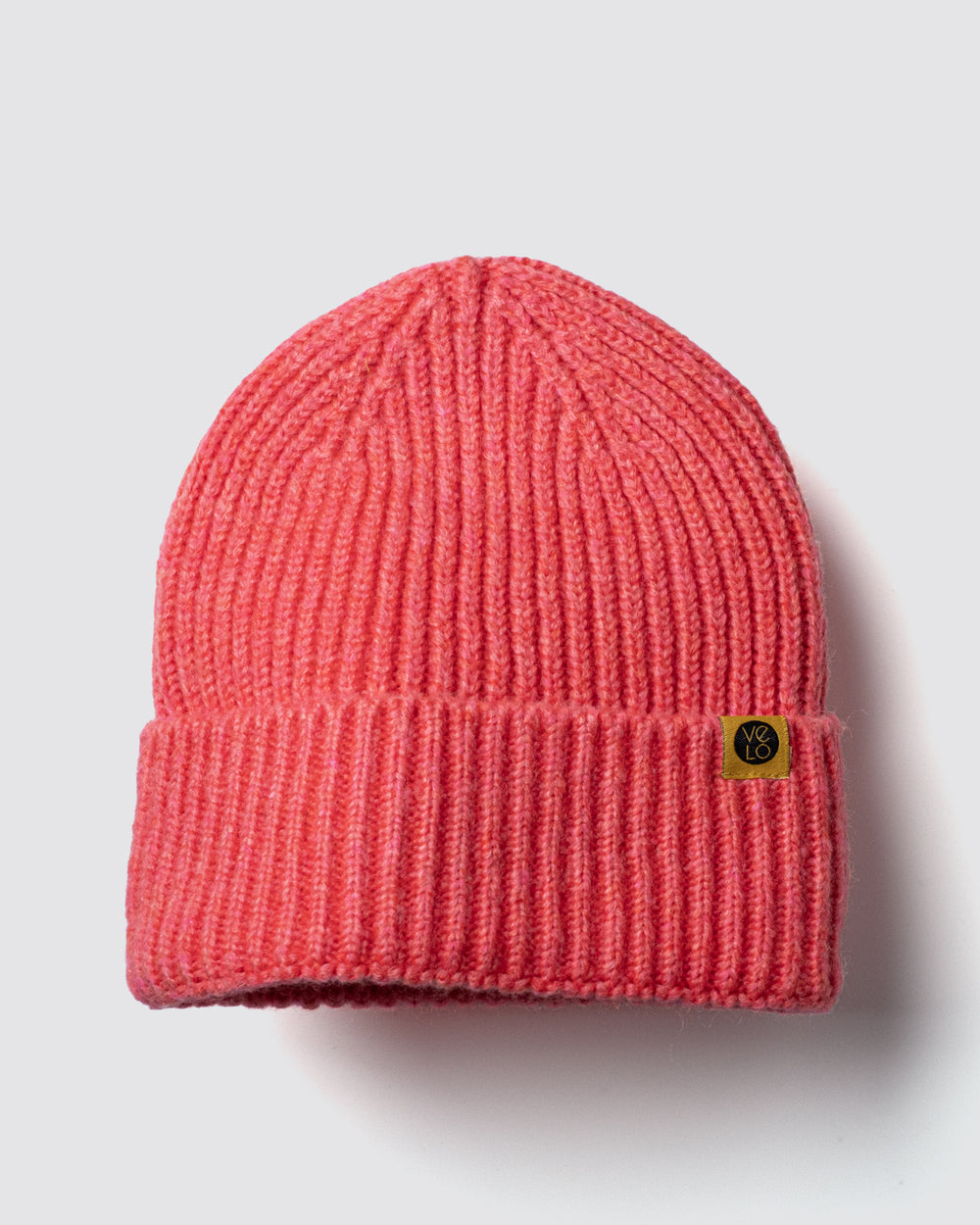 Coral Lux Beanie on a light gray background