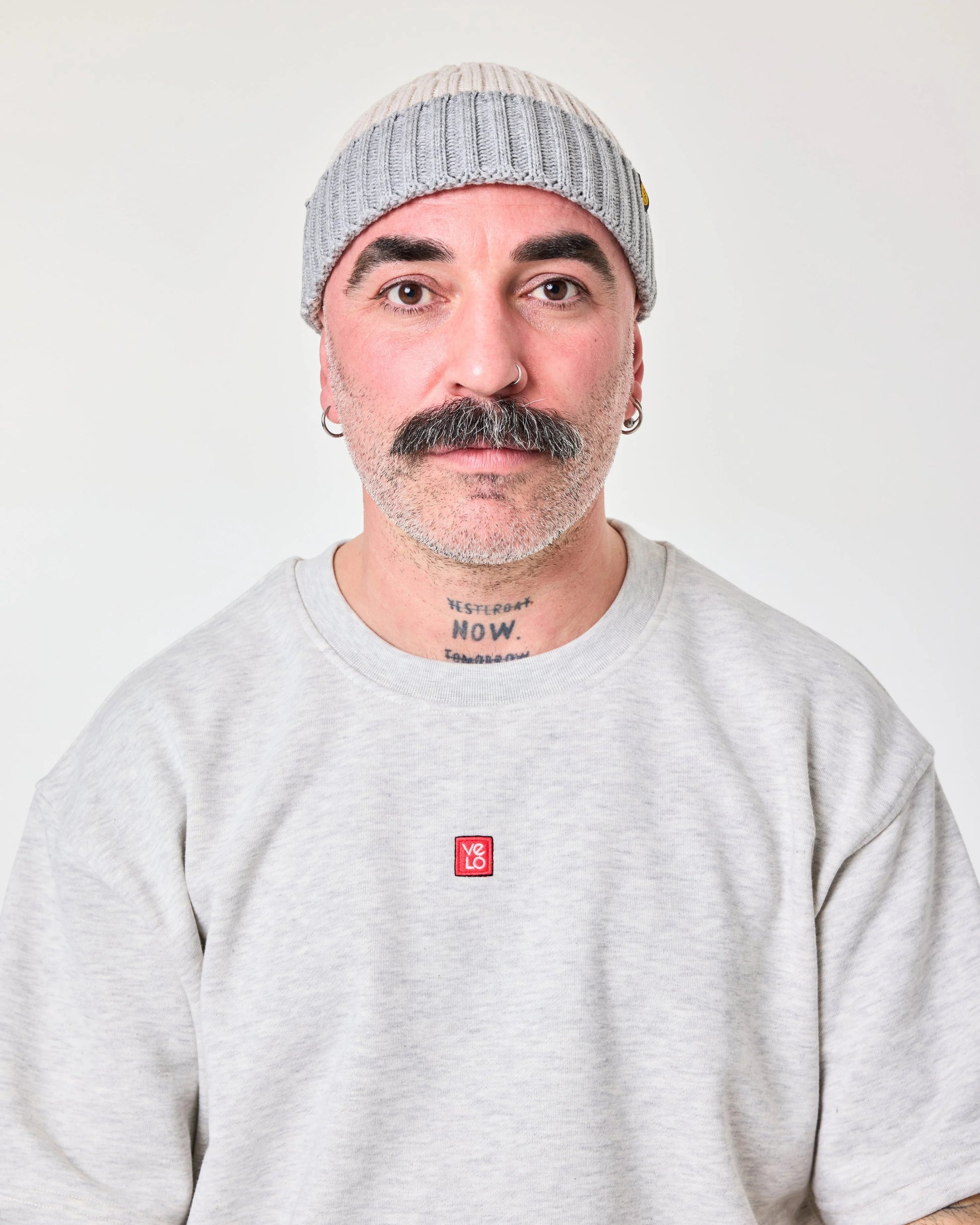 front view of a man wearing Crochet Pattern Cream Fisherman Beanie