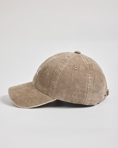 Beige corduroy cap on a light gray background
