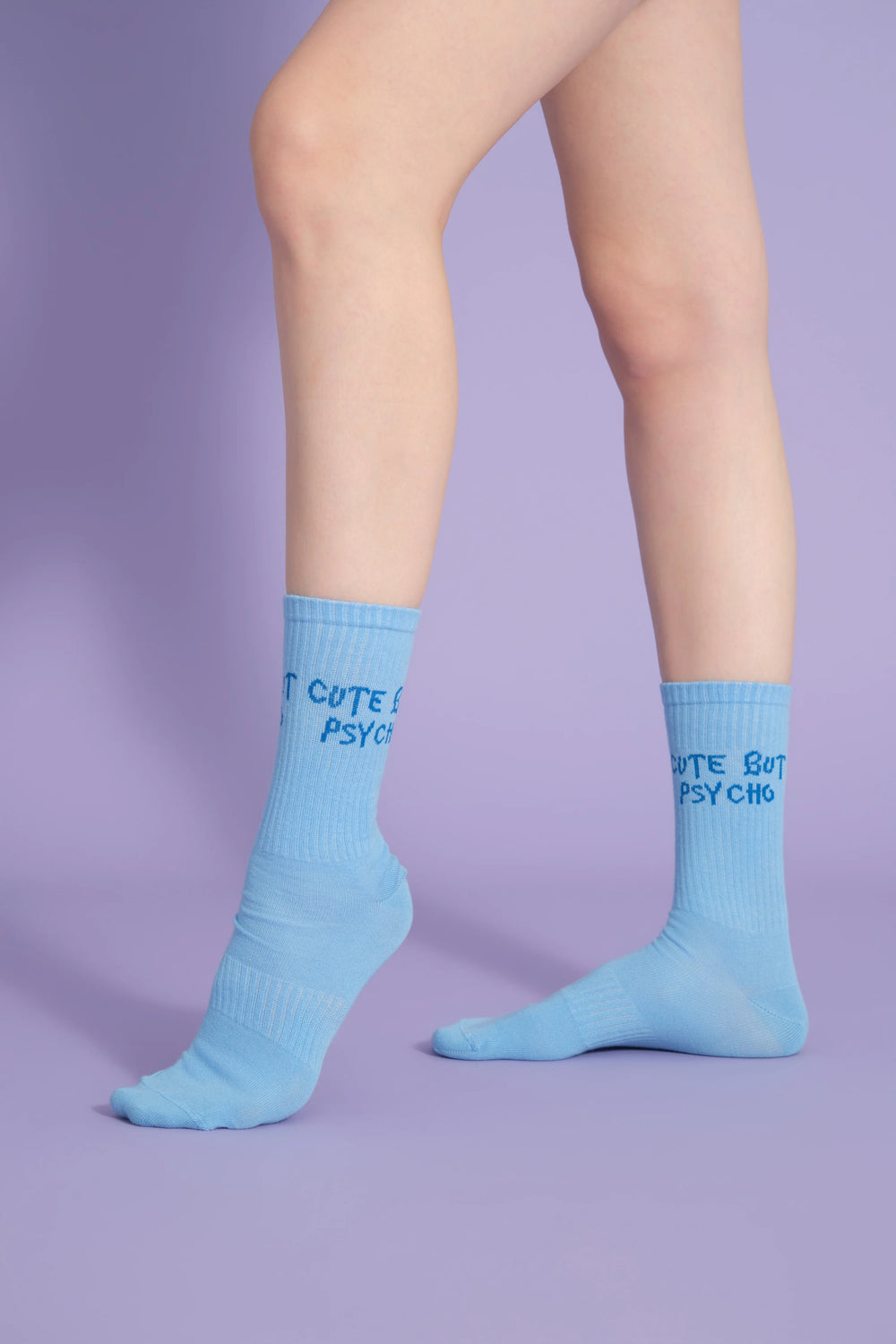 side view of blue cute but psycho socks