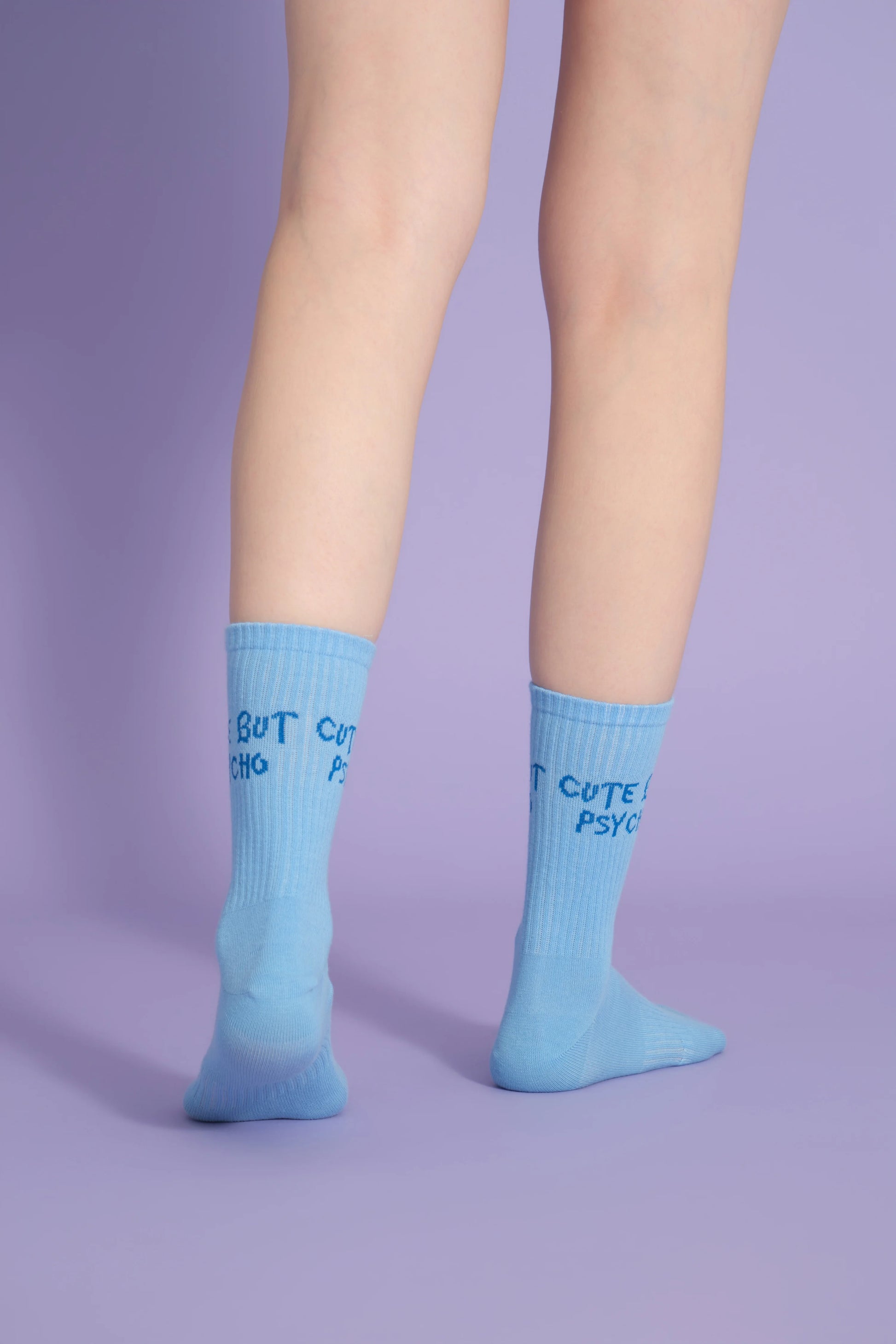 back view of blue cute but psycho socks