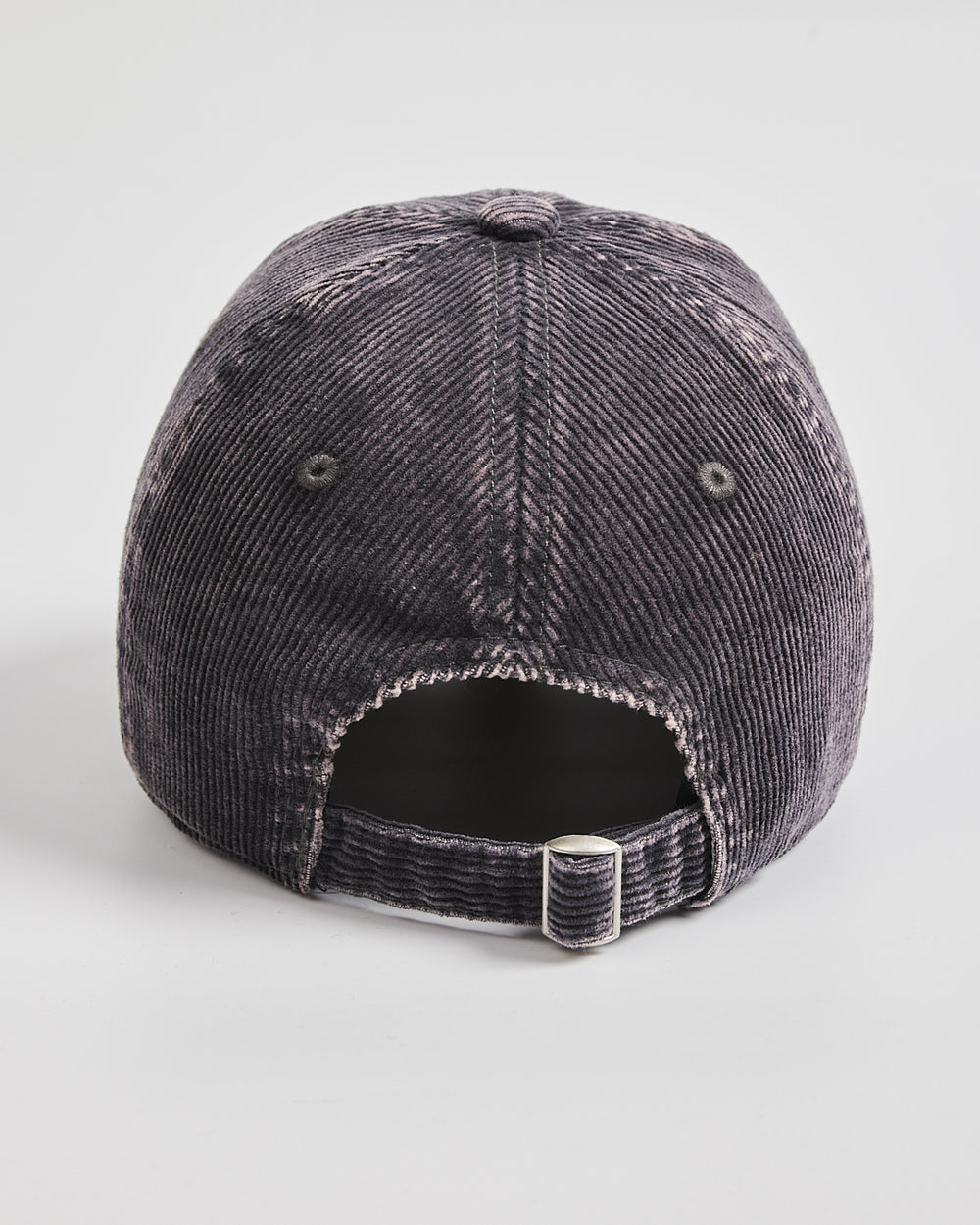 Back view of a charcoal grey cap on a light gray background