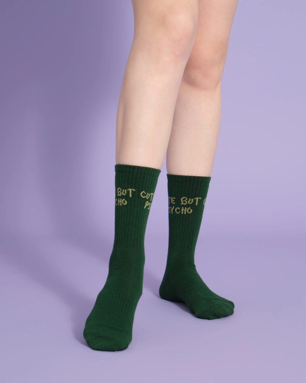 front view of green cute but psycho socks