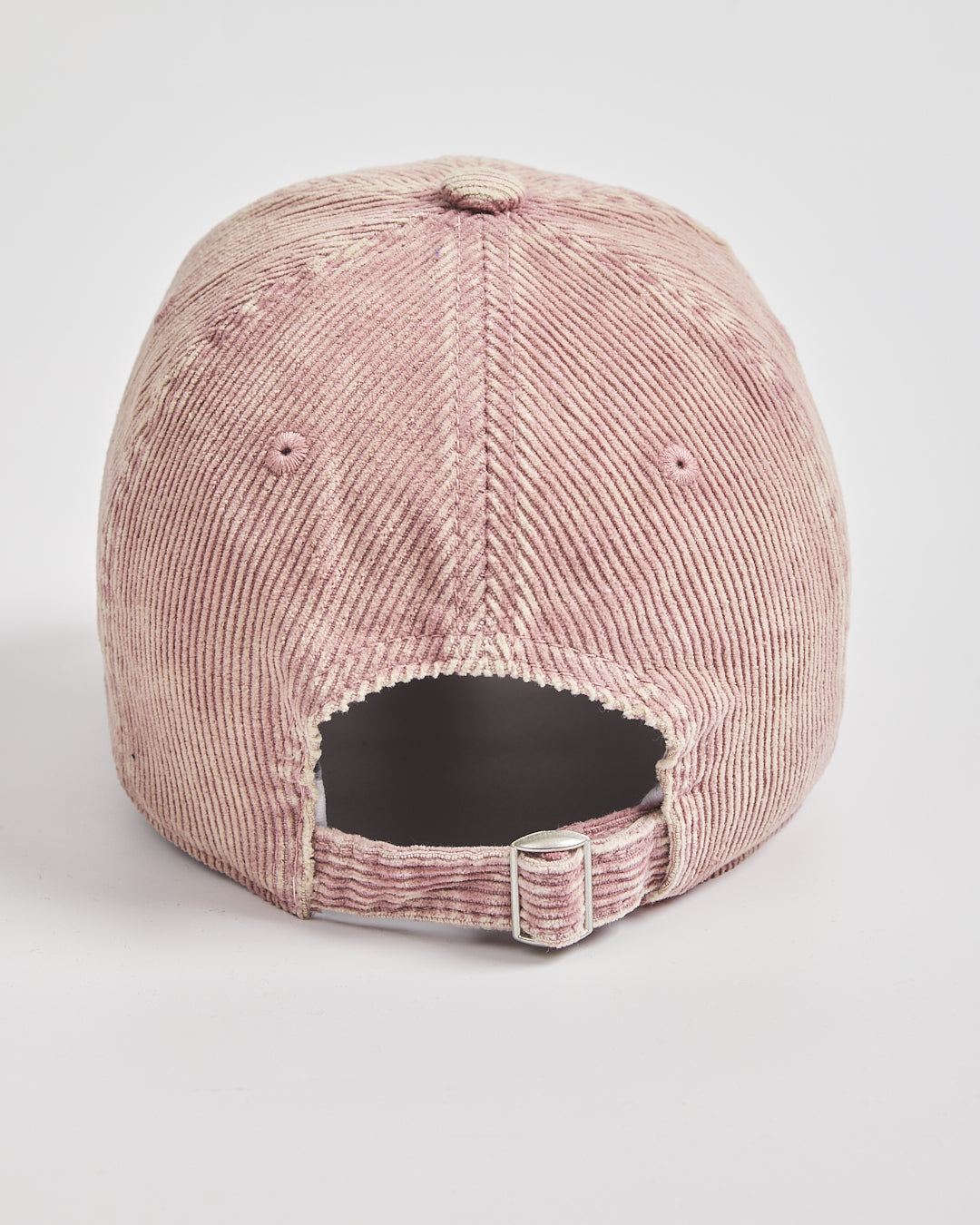 back look of dusty pink  corduroy cap on a light gray background