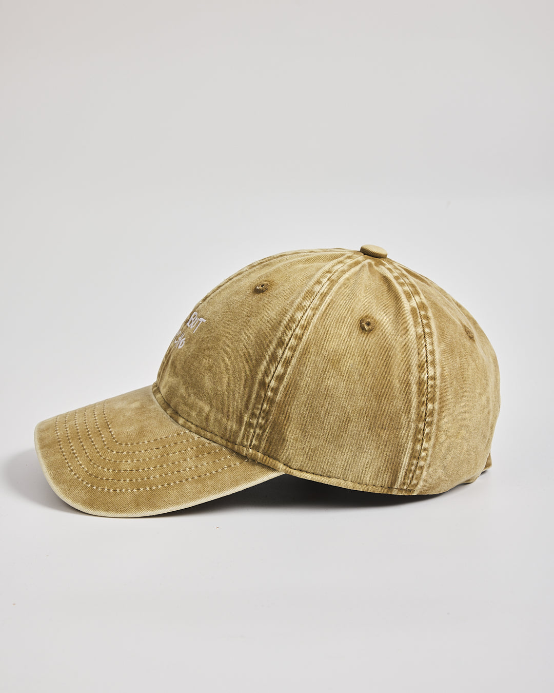 Cute But Psycho Yellow Washed Cap on a light gray background