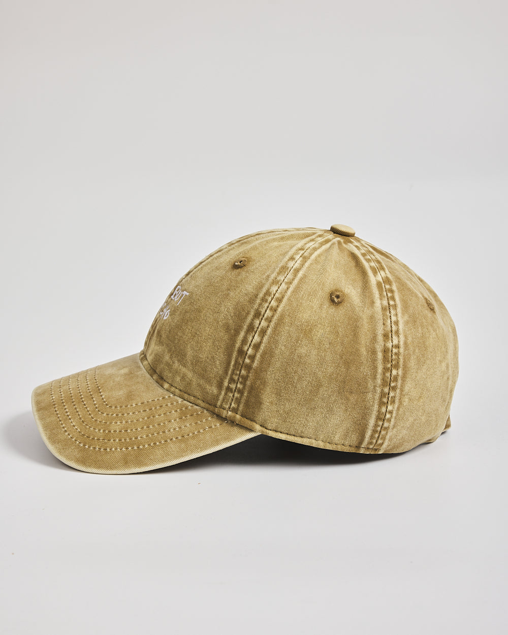 Cute But Psycho Yellow Washed Cap on a light gray background