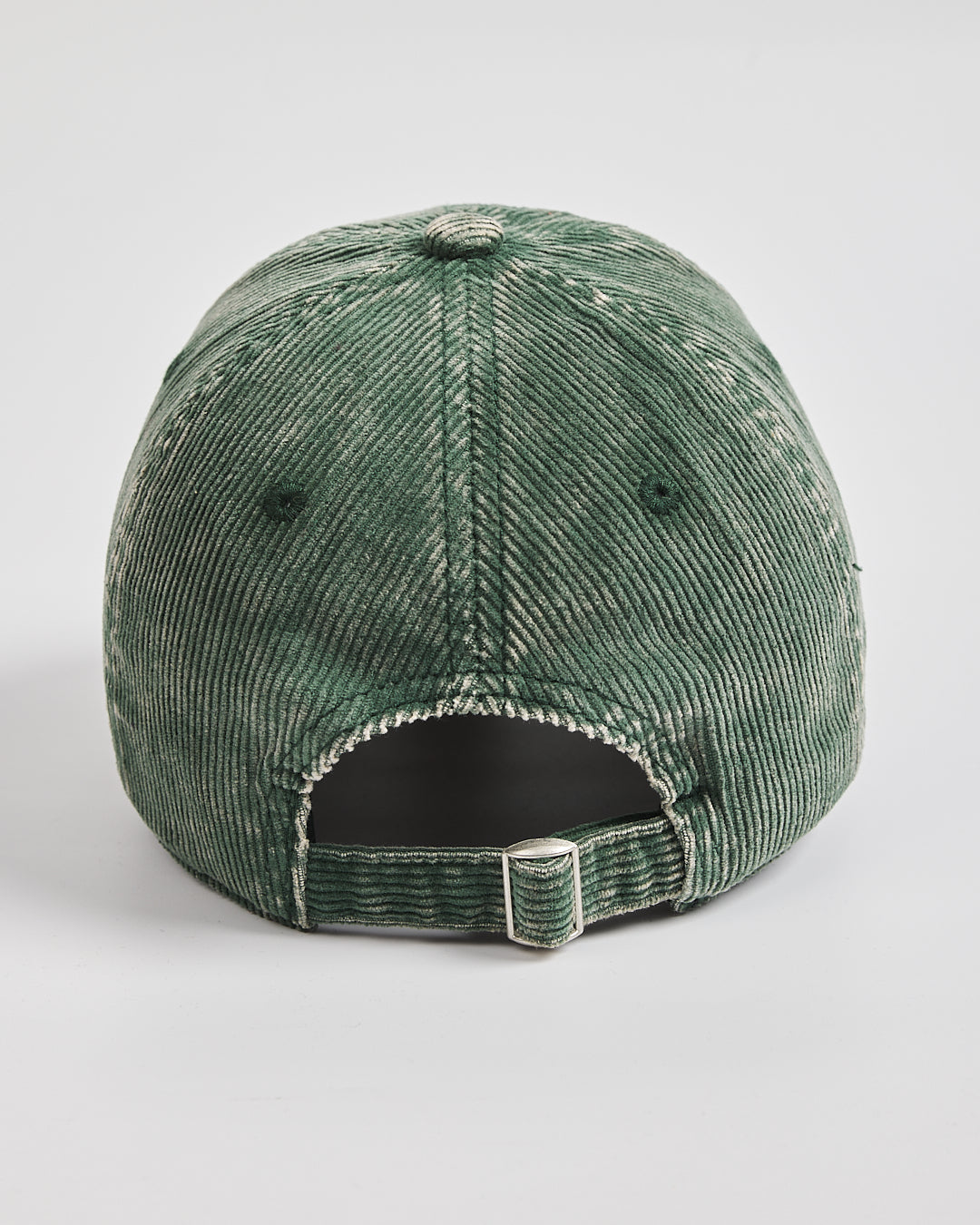 Back look of green corduroy cap on a white background with flip tag