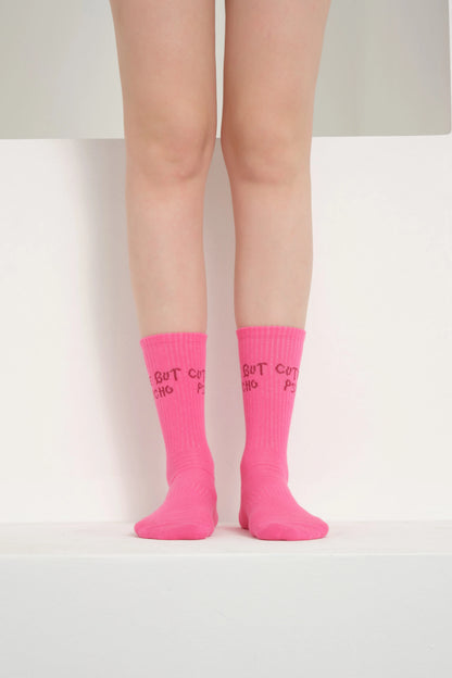 front view of a hot pink cute but psycho socks