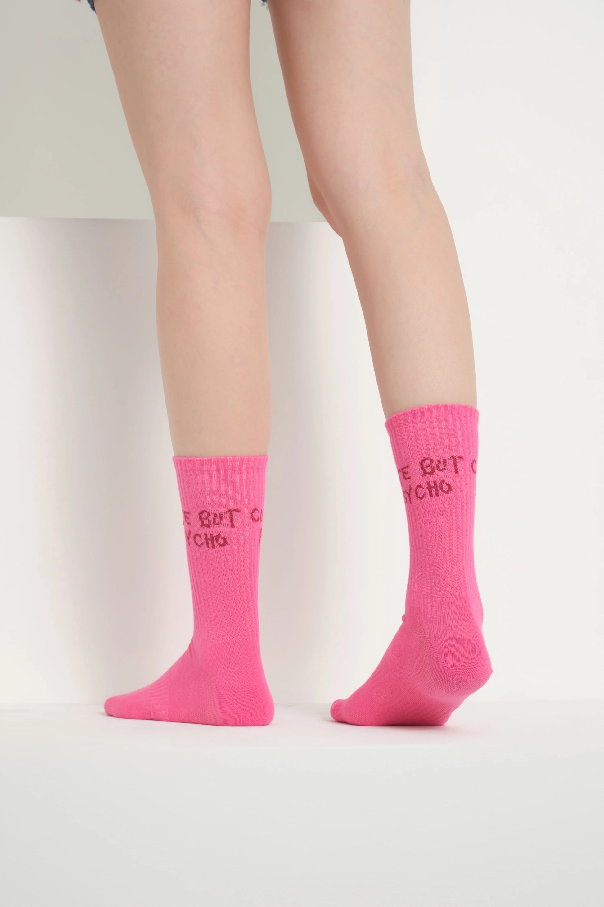 back view of a hot pink cute but psycho socks