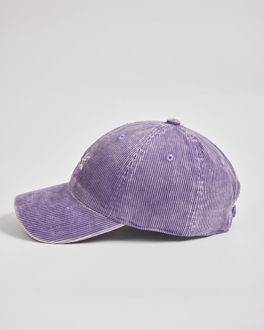 Purple corduroy cap on a light gray background