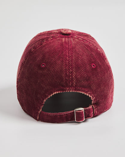 Back look of corduroy cap on a light gray background with flip tag