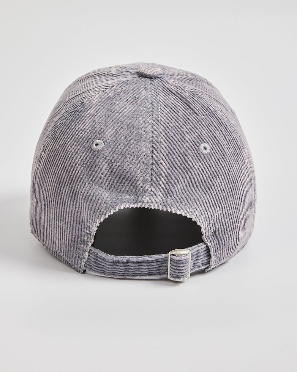 Gray corduroy cap on a light gray background