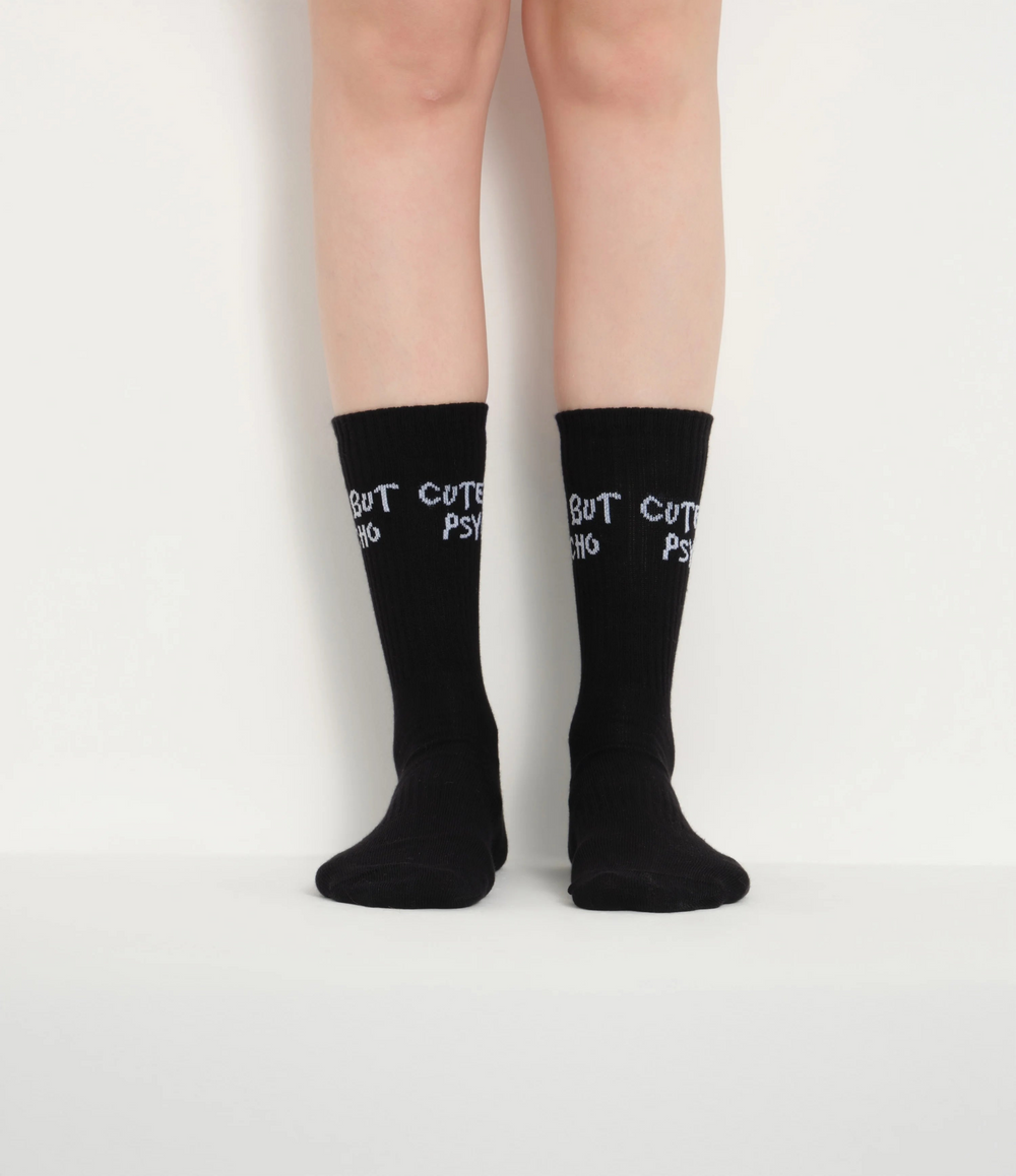 front view of black cute but psycho socks