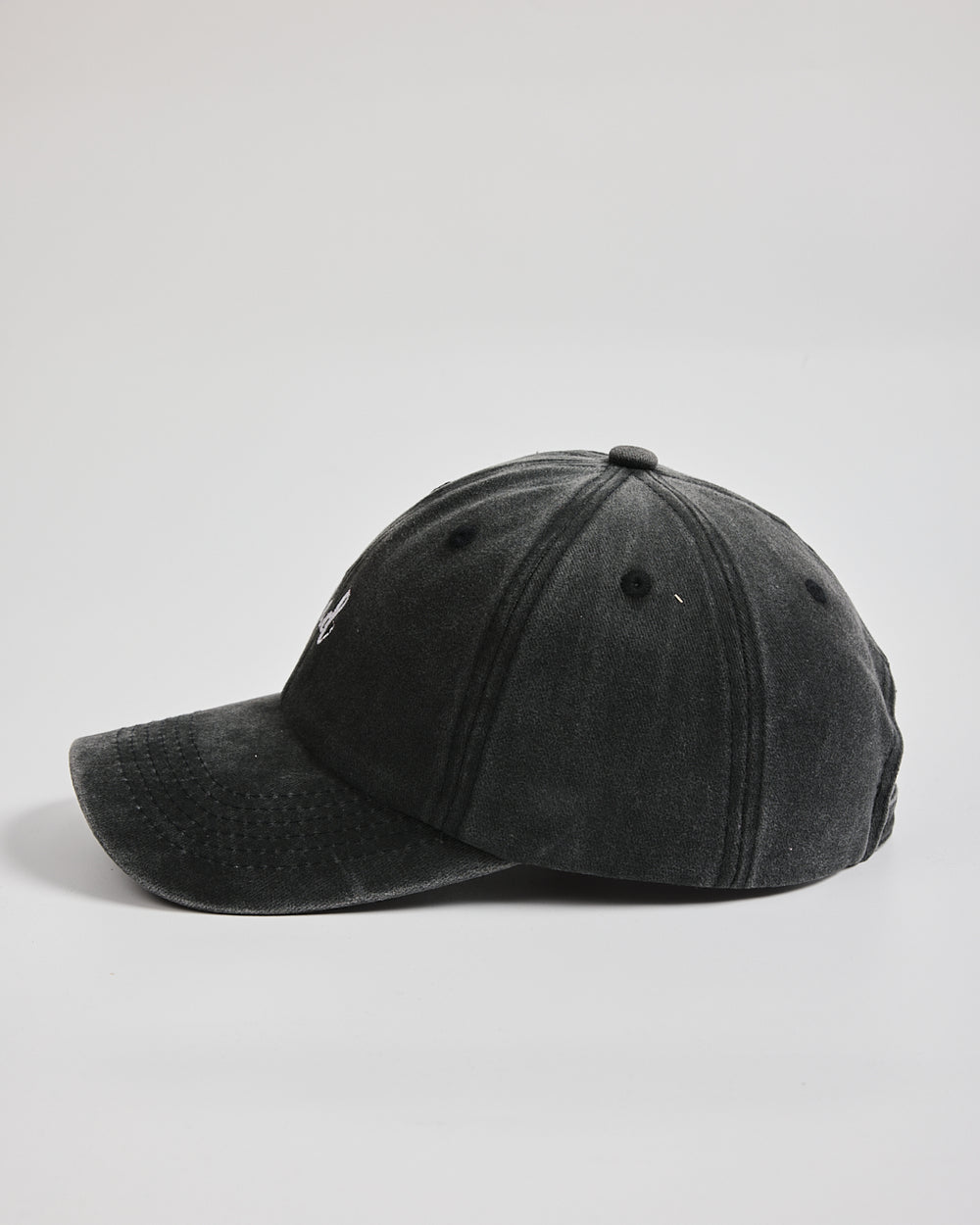 Dad Black Washed Caps on a light gray background