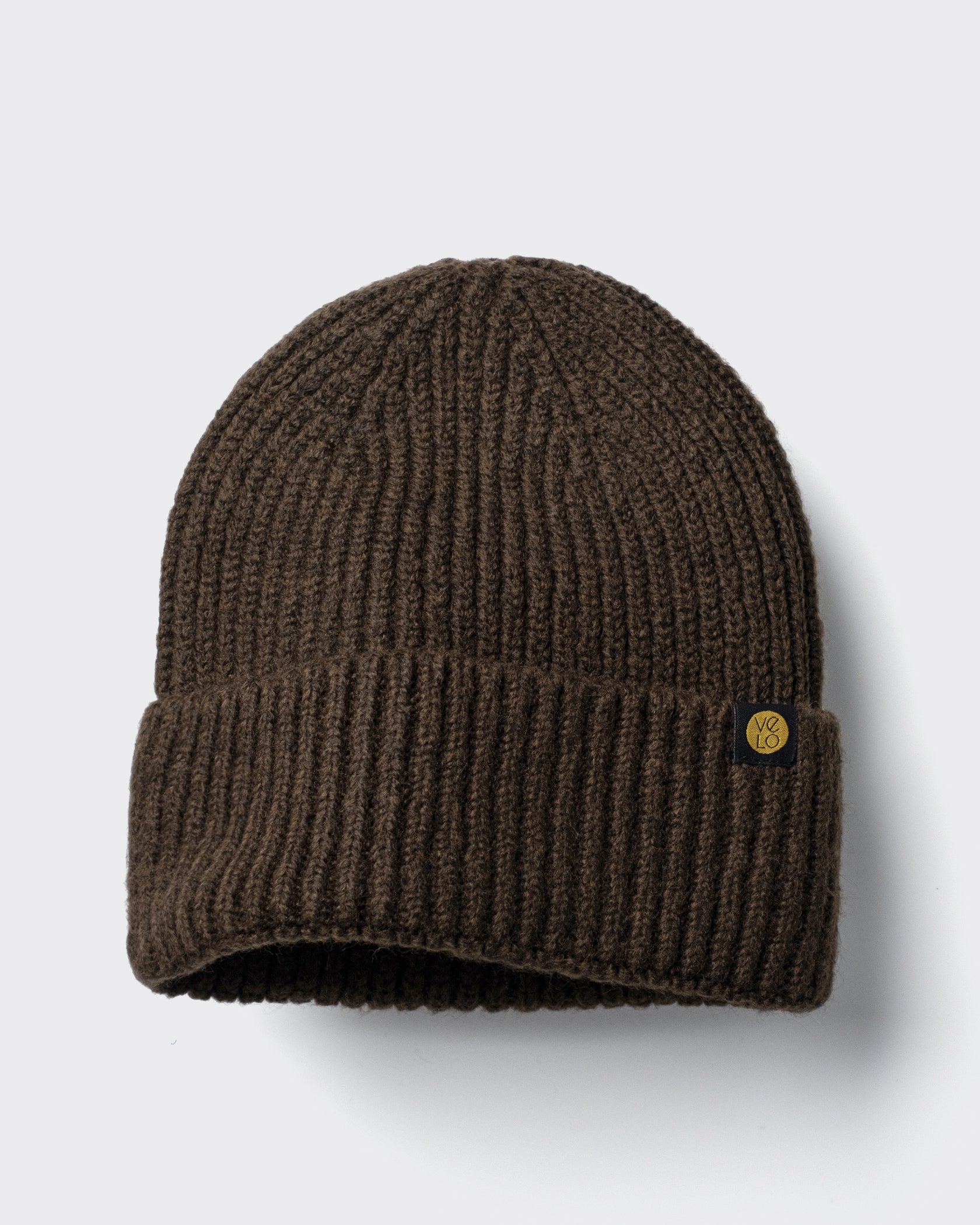 Dark Chocolate Lux Beanie on a light gray background