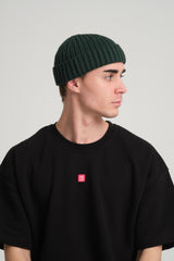 side view of a man wearing Dark Green Fisherman Beanie