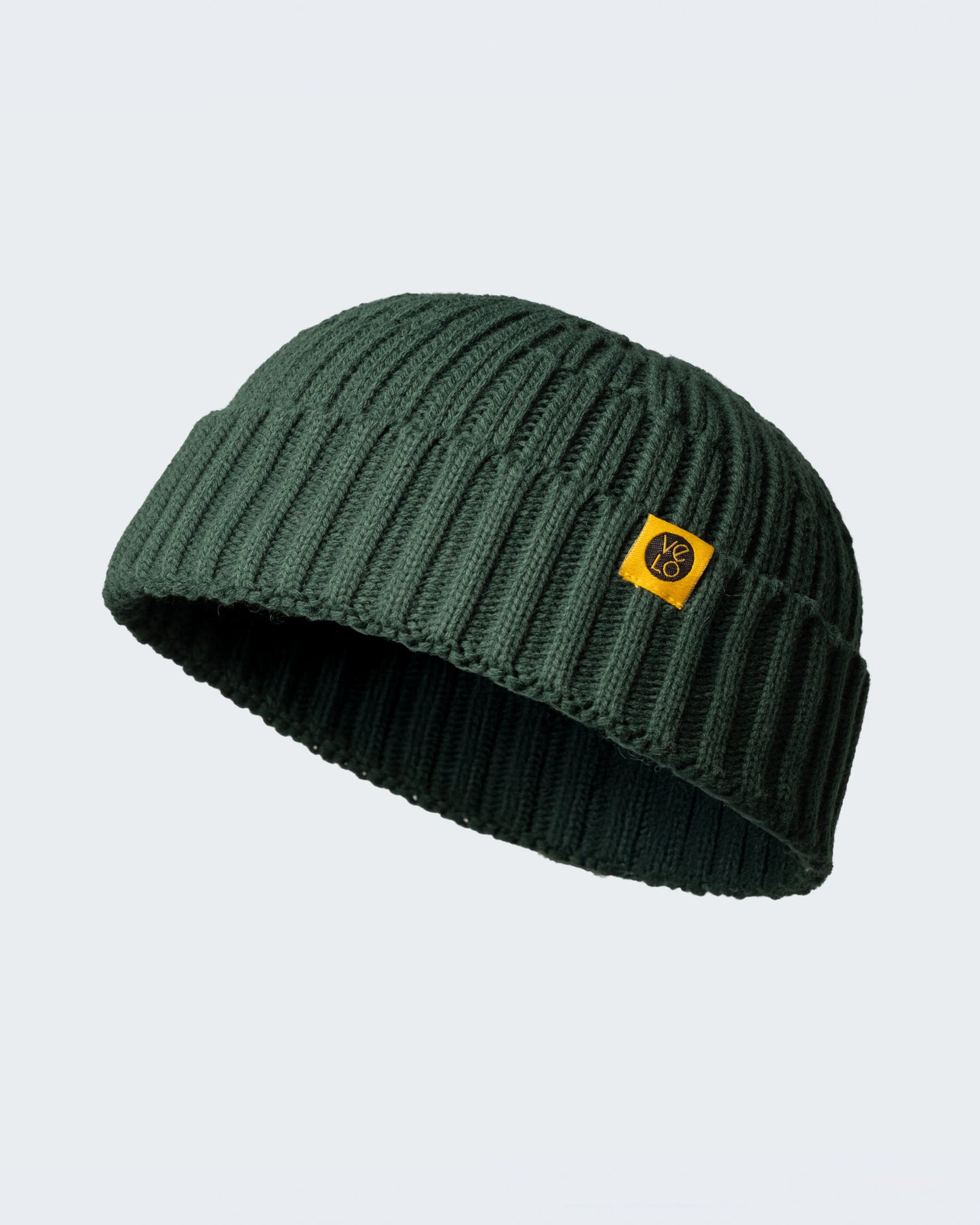 dark green fisherman beanie on a white background