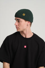 side view of a man wearing Dark Green Fisherman Beanie