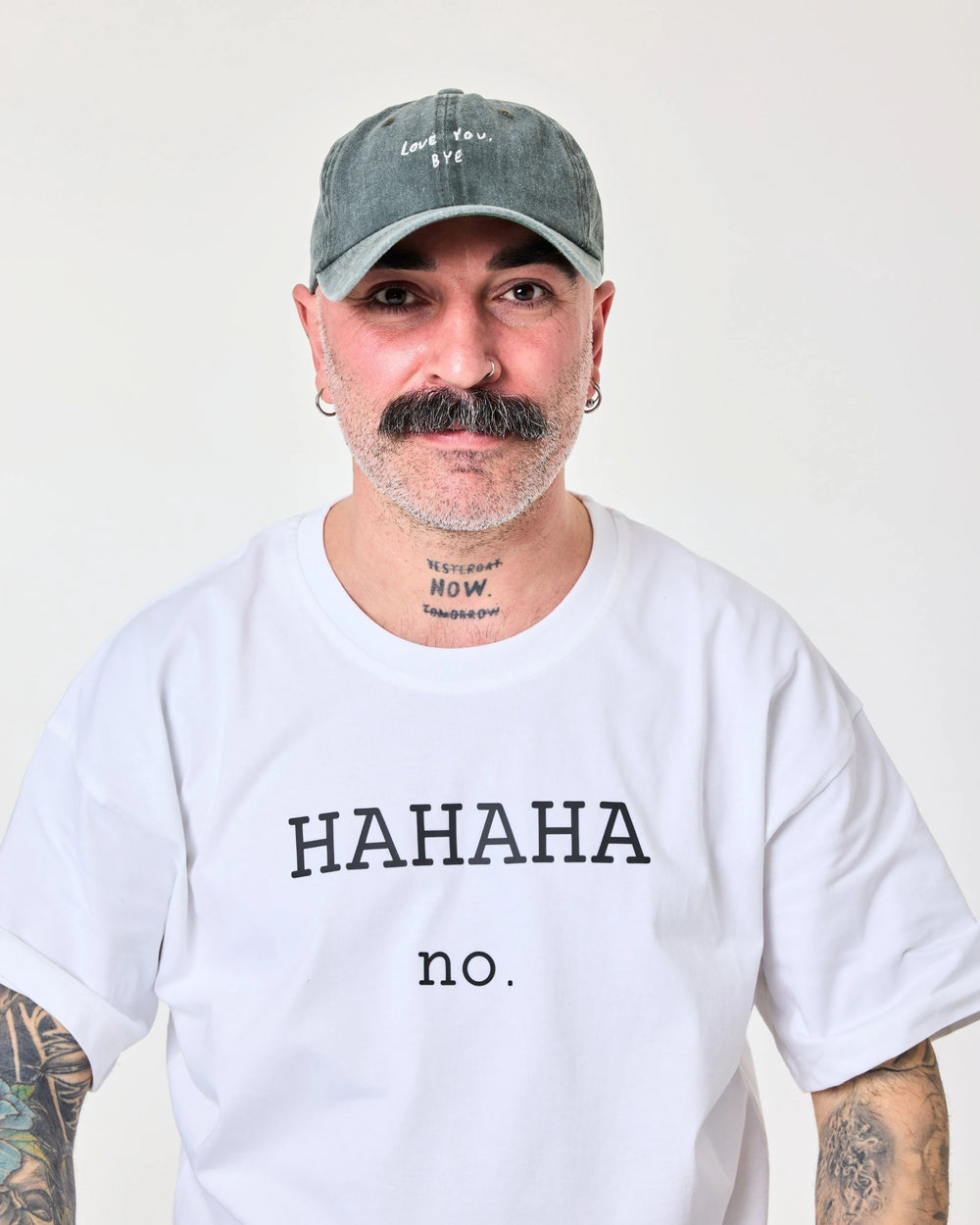 Man wearing Dark Green Washed Cap with 'Love You, Bye' embroidered in white.