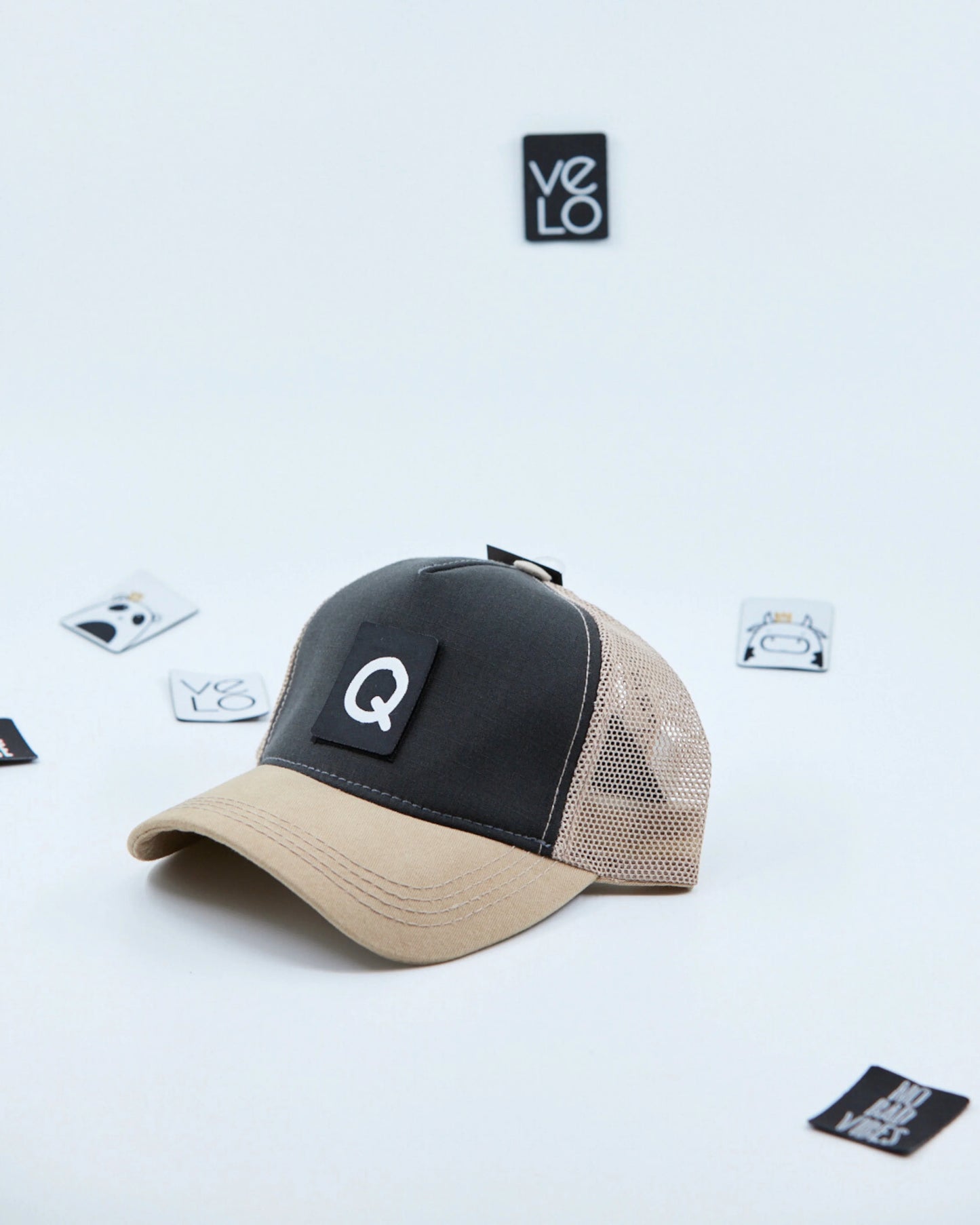 Side view of Dark Grey and Beige Trucker Cap with patches