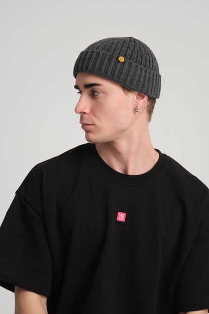 side view of a man wearing Dark Grey Fisherman Beanie